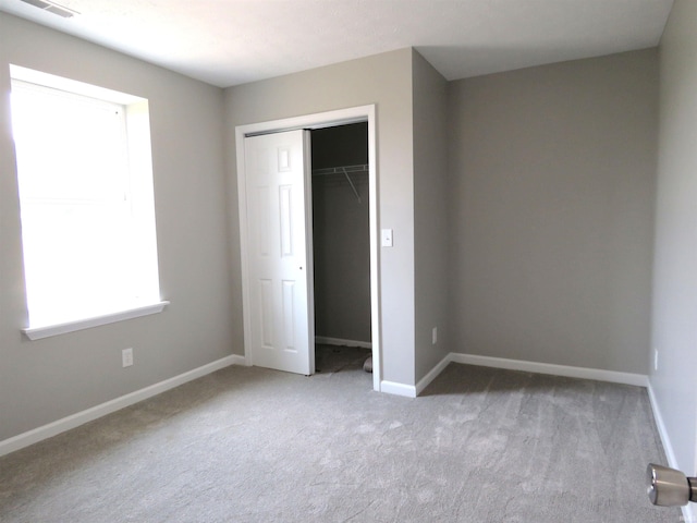 10239 State Road 26 E, Lafayette, IN 47905 - unfurnished bedroom with carpet and a closet