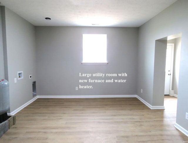 10239 State Road 26 E, Lafayette, IN 47905 - empty room with light wood finished floors and baseboards