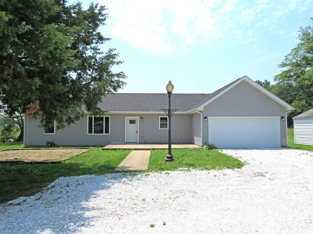 10239 State Road 26 E, Lafayette, IN 47905 - ranch-style house featuring an attached garage and a front yard