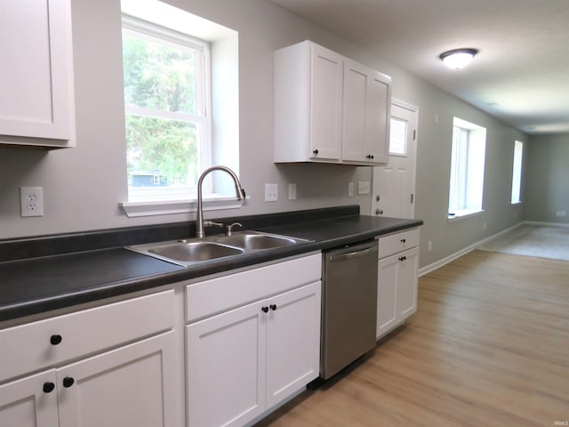 10239 State Road 26 E, Lafayette, IN 47905 - kitchen featuring stainless steel dishwasher, dark countertops, white cabinets, and light wood-type flooring