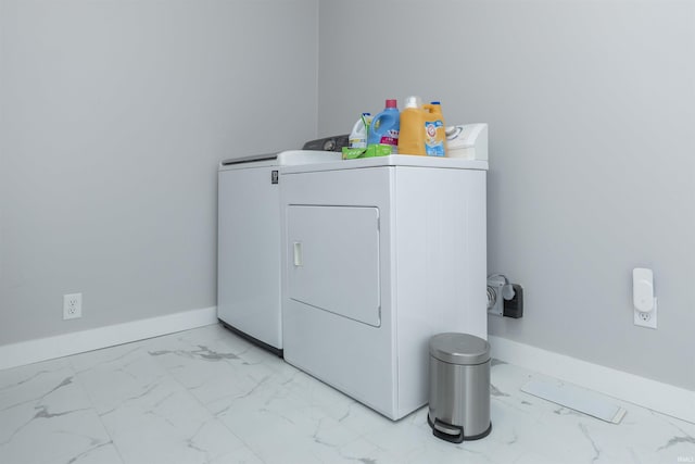 3623 Rexford Dr, South Bend, IN 46615 - laundry room with light marble finish floors and washer and clothes dryer