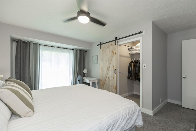 3623 Rexford Dr, South Bend, IN 46615 - bedroom featuring carpet, a barn door, a spacious closet, a closet, and ceiling fan