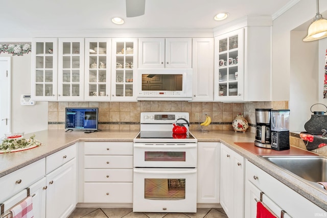 106 River Cove Ln, North Manchester, IN 46962 - kitchen with white appliances, white cabinets, decorative backsplash, and recessed lighting