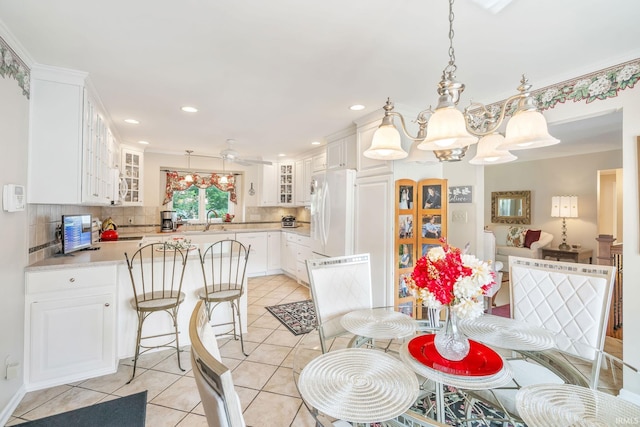 106 River Cove Ln, North Manchester, IN 46962 - dining area with light tile patterned floors, recessed lighting, ceiling fan, and ornamental molding