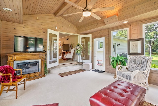 106 River Cove Ln, North Manchester, IN 46962 - carpeted living area featuring wood walls, wooden ceiling, ceiling fan, and a glass covered fireplace