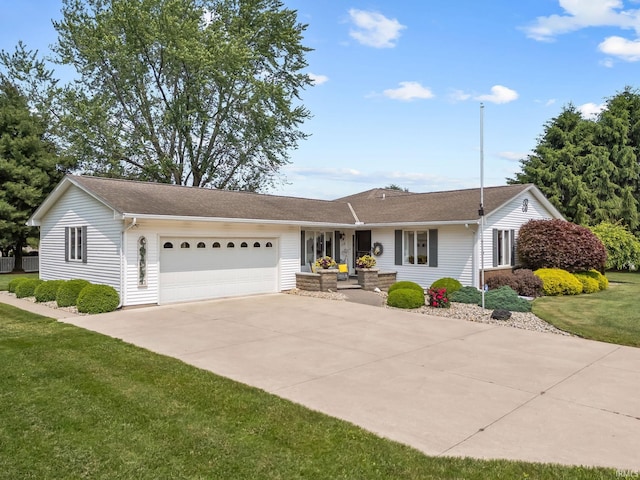 106 River Cove Ln, North Manchester, IN 46962 - single story home with an attached garage, driveway, and a front lawn