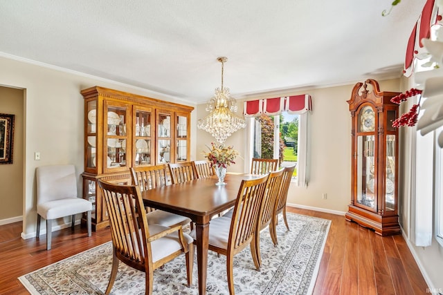 106 River Cove Ln, North Manchester, IN 46962 - dining room with a chandelier, wood finished floors, and ornamental molding