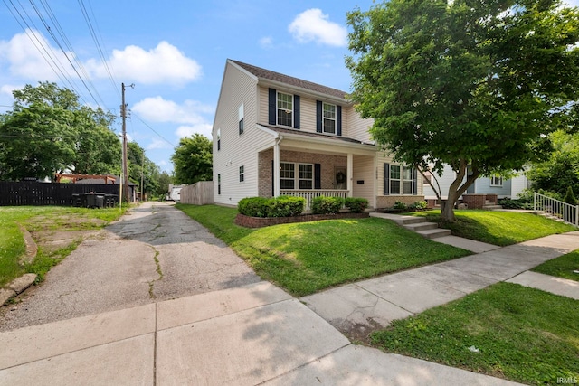 1009 Elliott St, Lafayette, IN 47905 - view of front of property with brick siding and covered porch