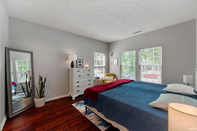 1009 Elliott St, Lafayette, IN 47905 - bedroom with hardwood / wood-style flooring and a textured ceiling