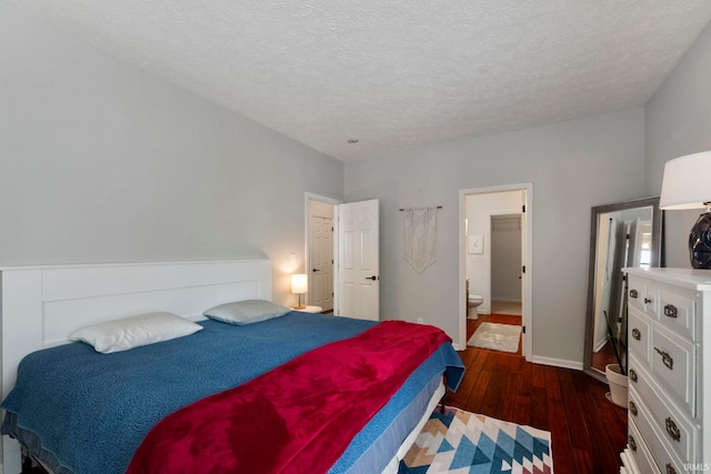 1009 Elliott St, Lafayette, IN 47905 - bedroom with dark wood-style flooring, a textured ceiling, and ensuite bathroom