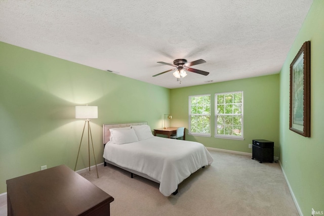 1009 Elliott St, Lafayette, IN 47905 - bedroom with a textured ceiling, a ceiling fan, and light colored carpet