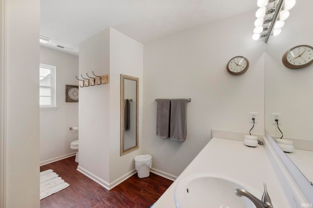1009 Elliott St, Lafayette, IN 47905 - bathroom with wood finished floors and vanity