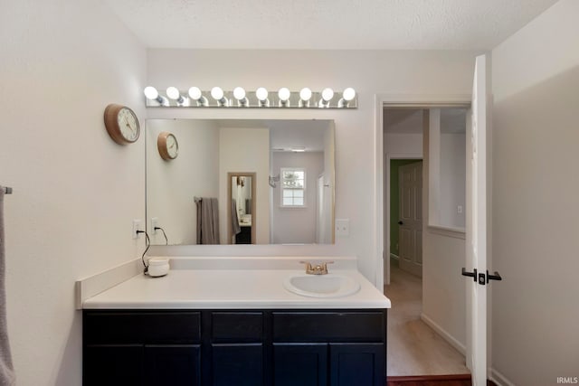 1009 Elliott St, Lafayette, IN 47905 - bathroom featuring vanity and a textured ceiling