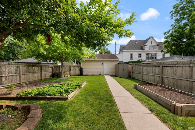 1009 Elliott St, Lafayette, IN 47905 - fenced backyard featuring a vegetable garden and a shed