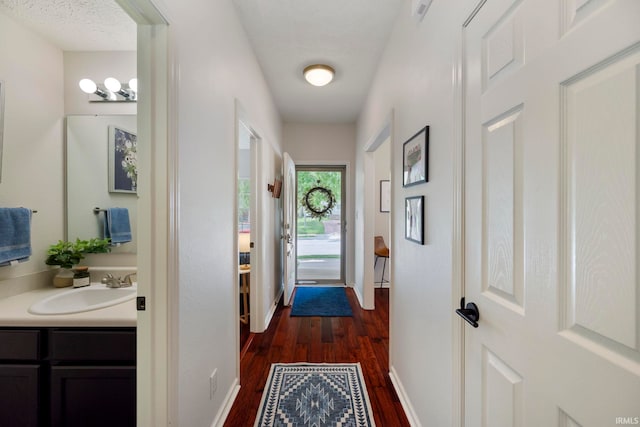 1009 Elliott St, Lafayette, IN 47905 - hallway with dark wood-style floors and a sink