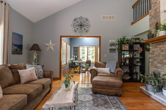 5549 S Tammany Ct, Bloomington, IN 47401 - living room featuring high vaulted ceiling and light wood-style flooring