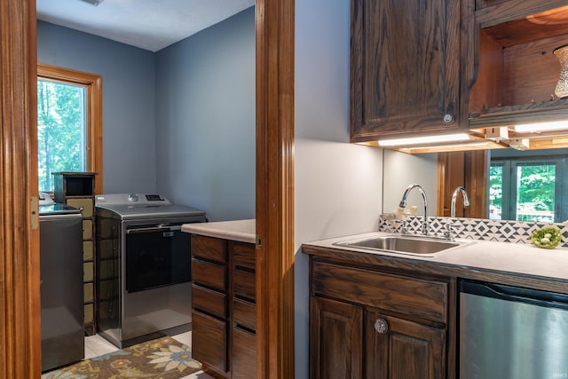 5549 S Tammany Ct, Bloomington, IN 47401 - kitchen with dishwashing machine, healthy amount of natural light, light countertops, and washer and clothes dryer