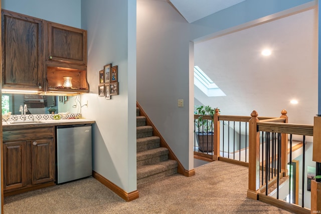 5549 S Tammany Ct, Bloomington, IN 47401 - indoor wet bar with light carpet, dishwashing machine, and plenty of natural light