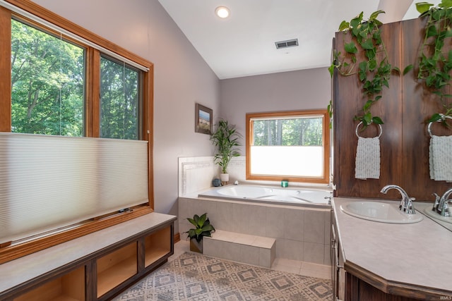5549 S Tammany Ct, Bloomington, IN 47401 - bathroom with a garden tub, vanity, tile patterned floors, vaulted ceiling, and recessed lighting
