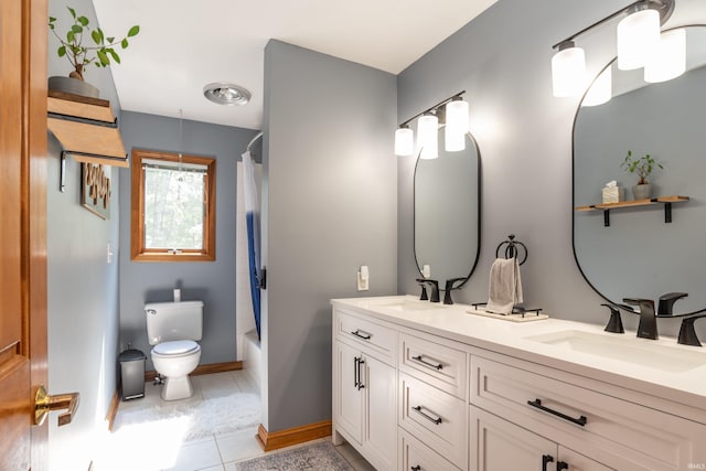 5549 S Tammany Ct, Bloomington, IN 47401 - full bathroom with double vanity, tile patterned flooring, and shower / tub combo with curtain