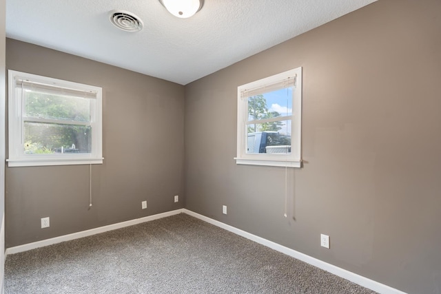 425 S Harding St, Warsaw, IN 46580 - carpeted spare room featuring baseboards and a textured ceiling