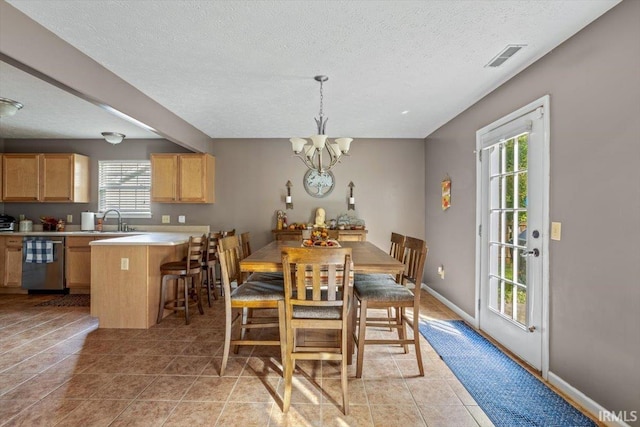4103 Stergen Dr, Lafayette, IN 47909 - dining room featuring a textured ceiling, a chandelier, and light tile patterned flooring