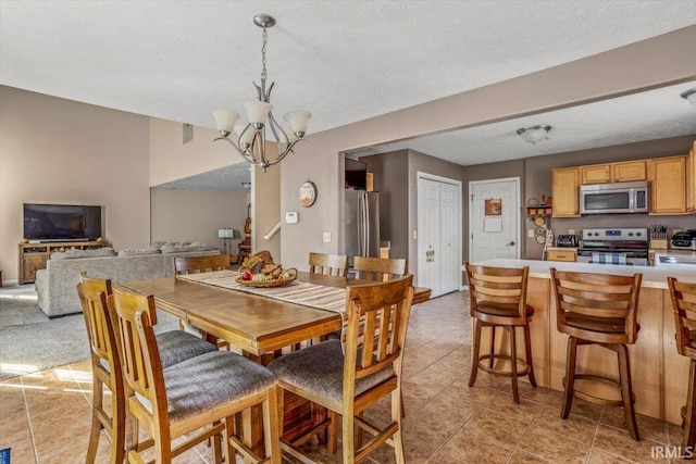 4103 Stergen Dr, Lafayette, IN 47909 - dining space featuring a textured ceiling, a chandelier, and light tile patterned floors