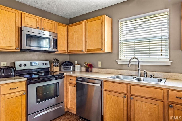 4103 Stergen Dr, Lafayette, IN 47909 - kitchen featuring appliances with stainless steel finishes, light countertops, and a textured ceiling