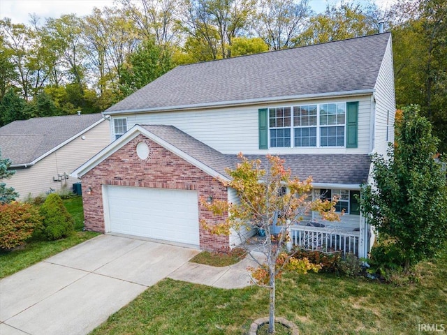 4103 Stergen Dr, Lafayette, IN 47909 - traditional home featuring brick siding, a garage, concrete driveway, and a shingled roof