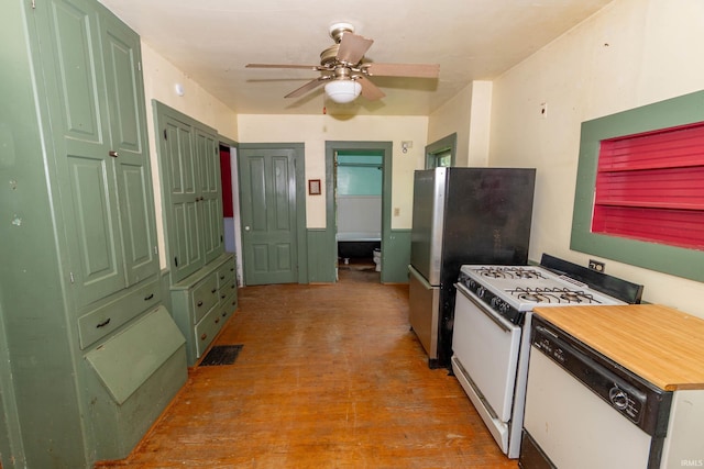 302 C St, Laporte, IN 46350 - kitchen featuring white appliances, a ceiling fan, and light wood-type flooring
