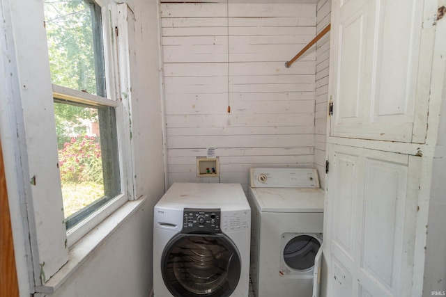 302 C St, Laporte, IN 46350 - laundry room with washing machine and dryer and wooden walls