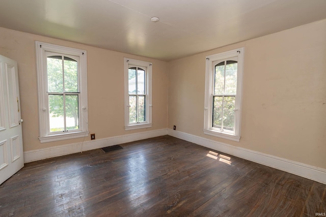 302 C St, Laporte, IN 46350 - empty room with dark wood-style flooring and baseboards