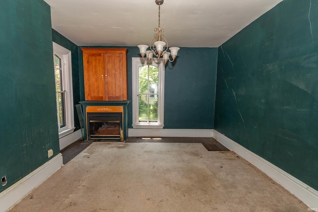 302 C St, Laporte, IN 46350 - unfurnished dining area with a chandelier and a fireplace with flush hearth