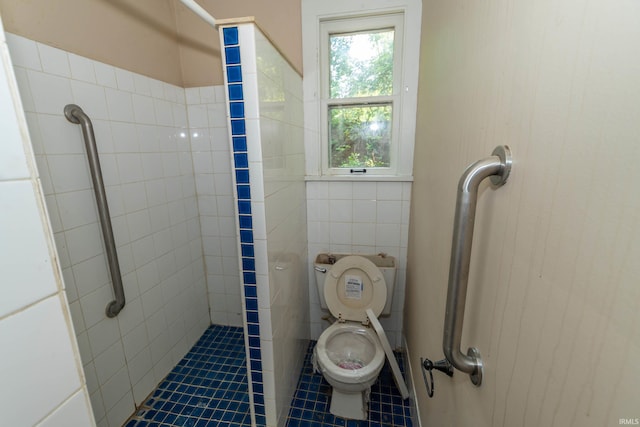 302 C St, Laporte, IN 46350 - bathroom with tile patterned floors, tile walls, and tiled shower