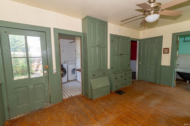 302 C St, Laporte, IN 46350 - foyer with washer and dryer, wood finished floors, wainscoting, and a ceiling fan
