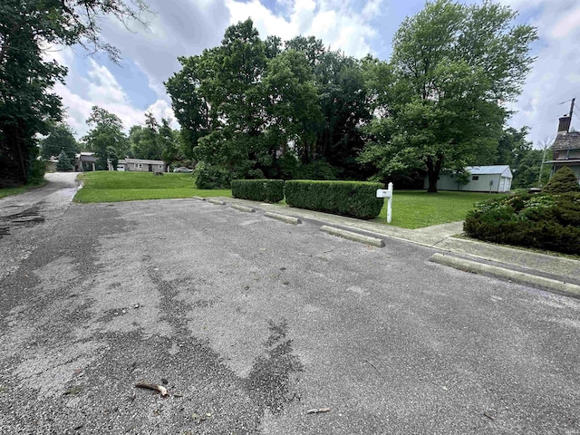 709 W Main St, Ellettsville, IN 47429 - view of asphalt road featuring sidewalks