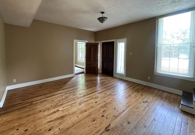 709 W Main St, Ellettsville, IN 47429 - entryway with wood-type flooring and a textured ceiling