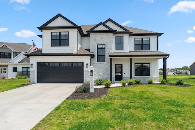 17464 Sonic Ct, Huntertown, IN 46748 - view of front of property with stone siding, an attached garage, a front lawn, and driveway