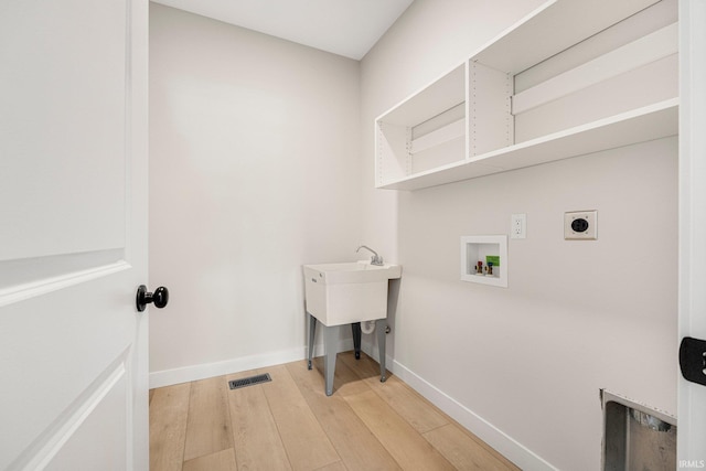 17464 Sonic Ct, Huntertown, IN 46748 - washroom with electric dryer hookup, light wood finished floors, and washer hookup