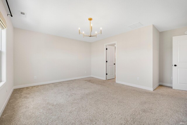 17464 Sonic Ct, Huntertown, IN 46748 - empty room featuring a chandelier and light colored carpet