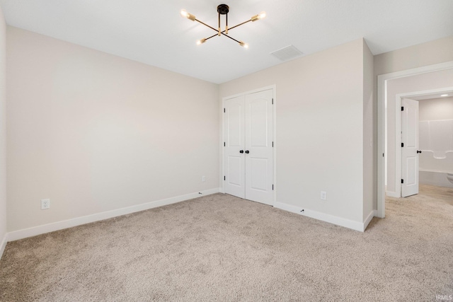 17464 Sonic Ct, Huntertown, IN 46748 - unfurnished bedroom featuring a chandelier, carpet floors, and a closet
