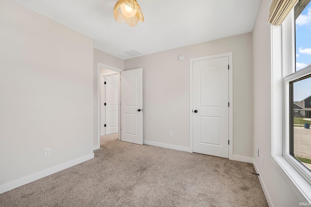 17464 Sonic Ct, Huntertown, IN 46748 - unfurnished bedroom featuring carpet floors and multiple windows