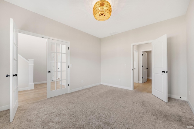 17464 Sonic Ct, Huntertown, IN 46748 - unfurnished bedroom featuring carpet floors and french doors