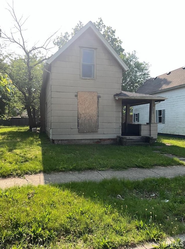 816 Allen St, South Bend, IN 46616 - back of house featuring a yard
