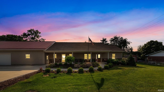 502 N Jefferson Ave, Fowler, IN 47944 - ranch-style home featuring a front yard, driveway, a porch, and stone siding