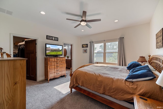 502 N Jefferson Ave, Fowler, IN 47944 - bedroom featuring light carpet, a walk in closet, recessed lighting, ensuite bathroom, and a ceiling fan