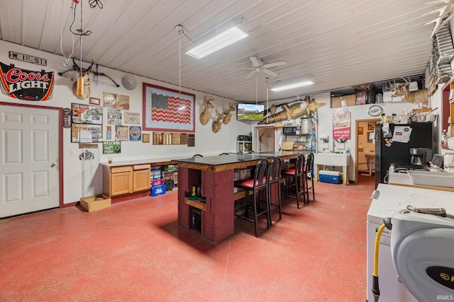 502 N Jefferson Ave, Fowler, IN 47944 - miscellaneous room featuring a ceiling fan and washer / dryer