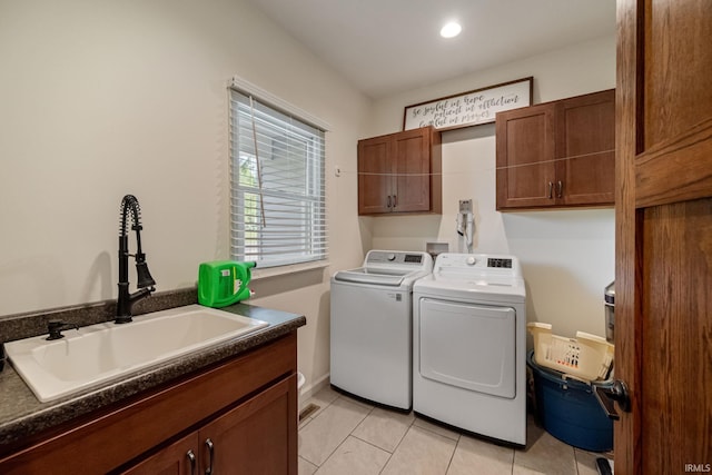502 N Jefferson Ave, Fowler, IN 47944 - laundry room with cabinet space, washing machine and clothes dryer, light tile patterned floors, and recessed lighting