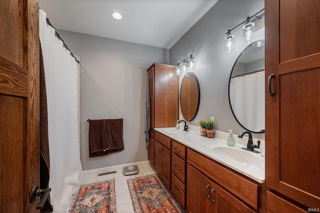 502 N Jefferson Ave, Fowler, IN 47944 - bathroom with double vanity and tile patterned flooring
