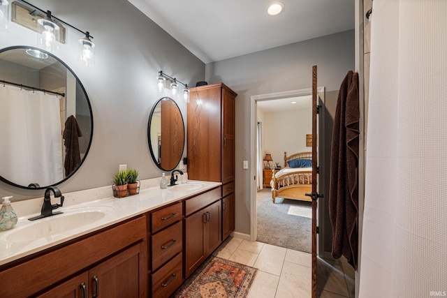 502 N Jefferson Ave, Fowler, IN 47944 - full bath featuring double vanity, ensuite bath, tile patterned floors, and a shower with shower curtain